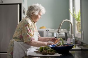 17510-an-elderly-woman-washing-produce-pv
